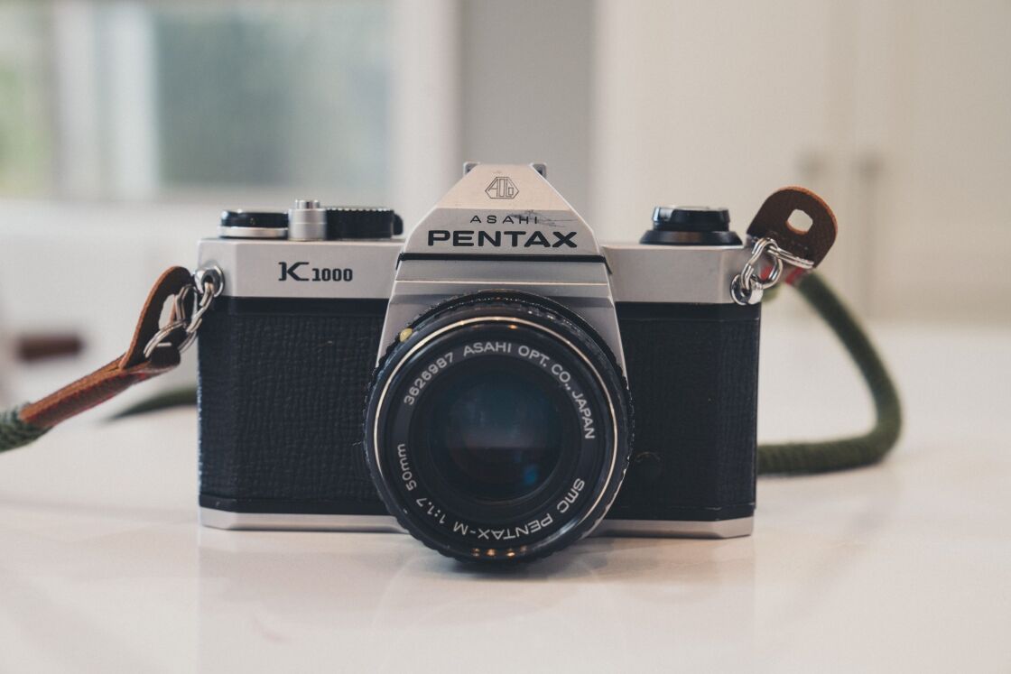 image of pentax k1000 film camera on white counter