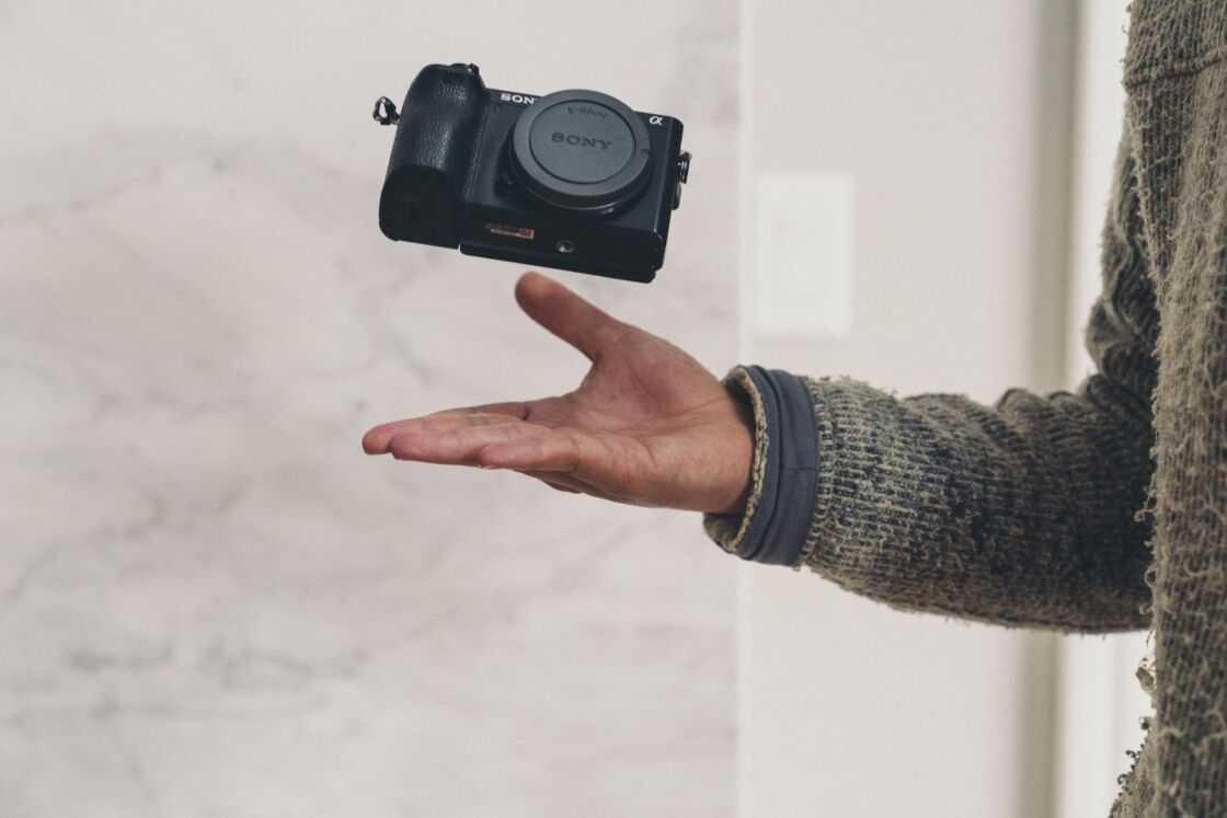 image of camera thrown up with a white background