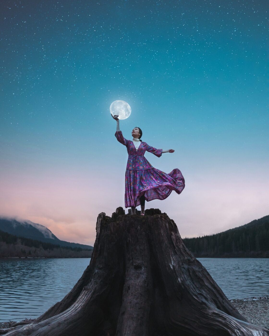 Photoshop edit of a girl holding up the moon